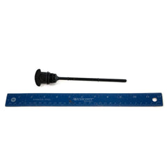 A black Oil Dipstick by Polaris is placed above a blue 12-inch ruler on a white background, showing it measures about 10 inches long.